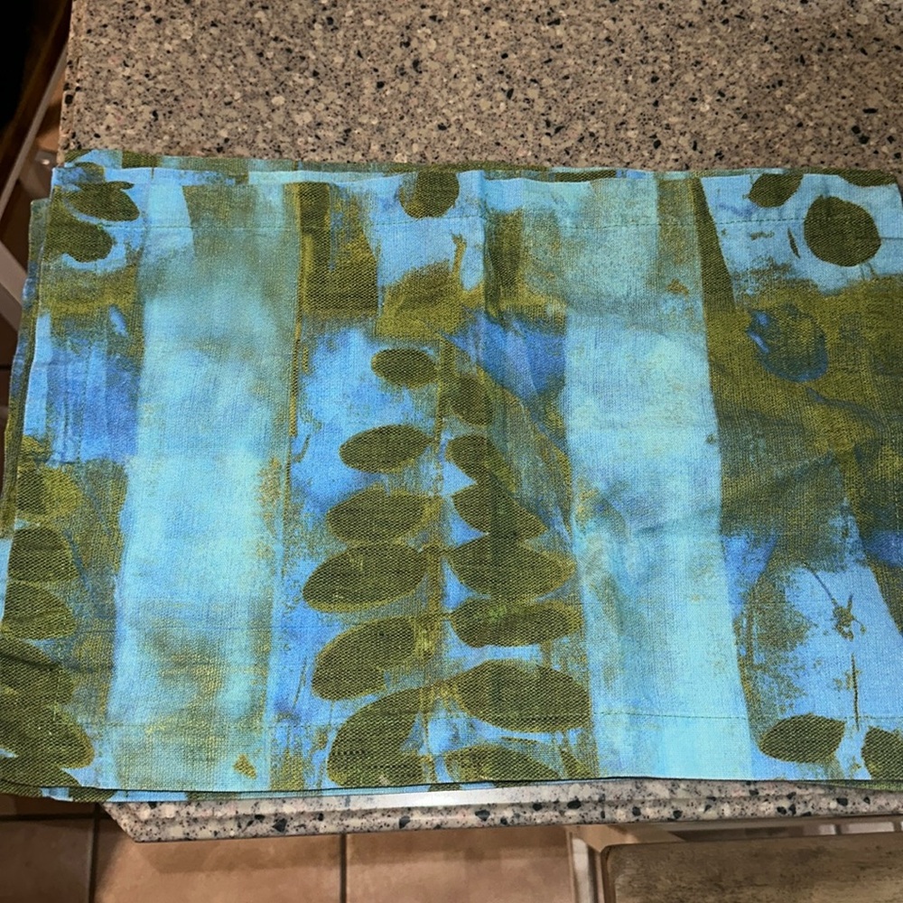 4 placemats by Vietri. Very pretty and can be washed.